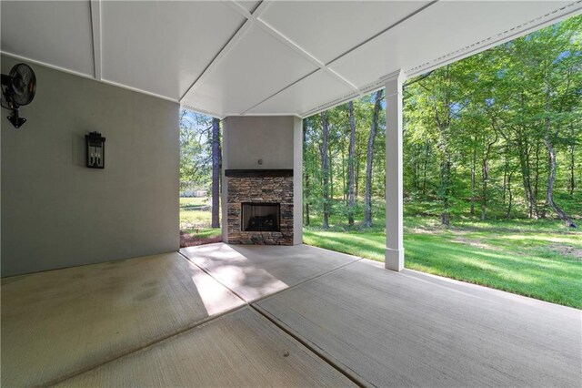view of patio with a stone fireplace