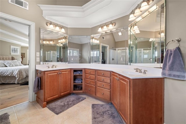 full bath with ensuite bath, visible vents, ornamental molding, and vanity