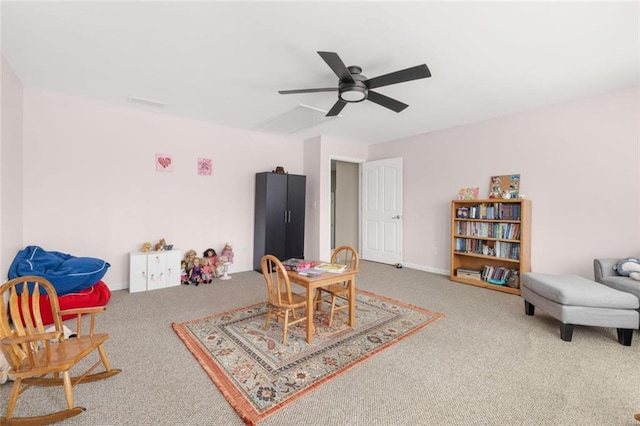 recreation room with carpet, baseboards, and ceiling fan