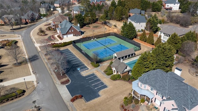 birds eye view of property with a residential view