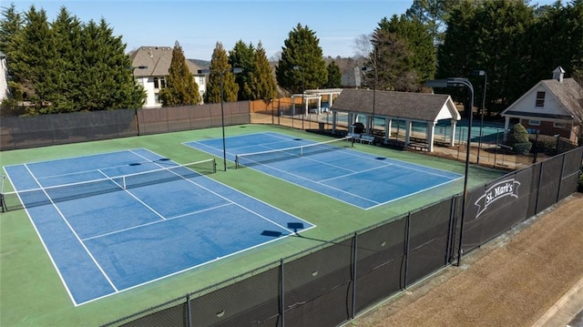 view of sport court with fence