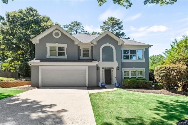 view of front of house featuring a garage and a front yard