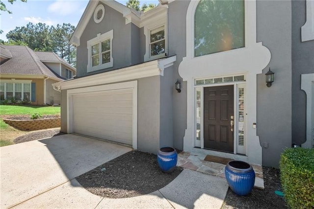 doorway to property featuring a garage