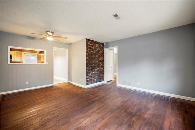 unfurnished living room featuring a textured ceiling, ceiling fan, and dark wood-type flooring