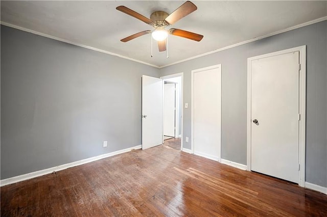 unfurnished bedroom with ceiling fan, wood-type flooring, and ornamental molding