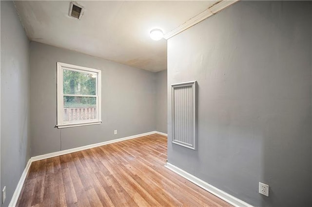 spare room with light hardwood / wood-style floors