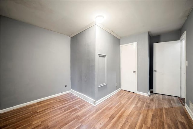 empty room with light hardwood / wood-style floors