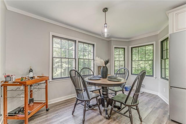 323 Schoolhouse Rd, Rockmart, GA 30153 - dining space featuring light wood-style flooring and ornamental molding