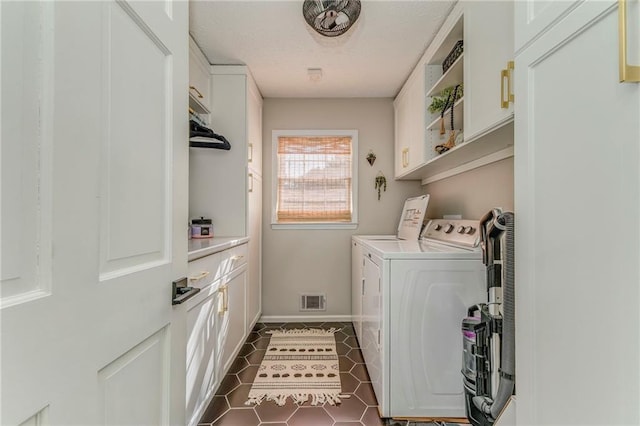 323 Schoolhouse Rd, Rockmart, GA 30153 - laundry room featuring independent washer and dryer, cabinet space, and dark tile patterned flooring