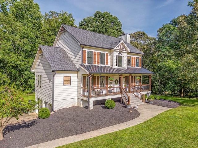 323 Schoolhouse Rd, Rockmart, GA 30153 - view of front facade featuring a porch, a chimney, a shingled roof, a front lawn, and a metal roof