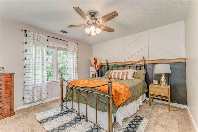 323 Schoolhouse Rd, Rockmart, GA 30153 - bedroom featuring light carpet, ceiling fan, and a textured ceiling
