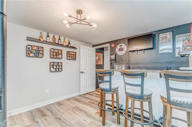 323 Schoolhouse Rd, Rockmart, GA 30153 - indoor bar with a chandelier and light wood-style flooring