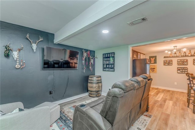 323 Schoolhouse Rd, Rockmart, GA 30153 - living room with light wood-style flooring, beamed ceiling, and a chandelier