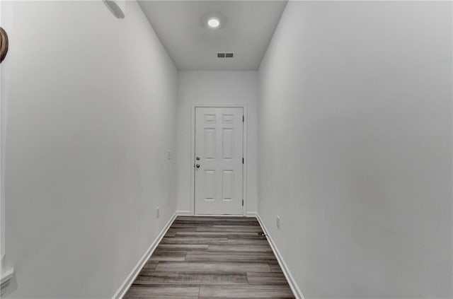 hallway featuring hardwood / wood-style flooring