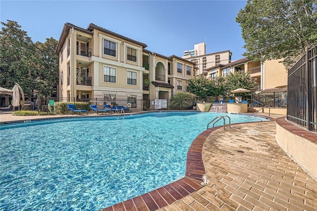 view of swimming pool with a patio area