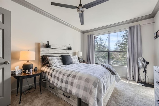 carpeted bedroom with ceiling fan and ornamental molding