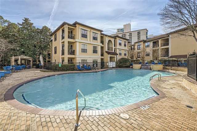 view of swimming pool featuring a patio area