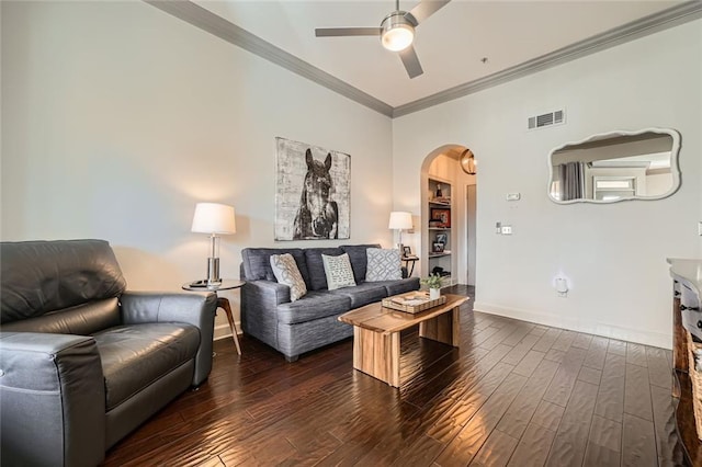 living room with ornamental molding, dark hardwood / wood-style floors, and ceiling fan