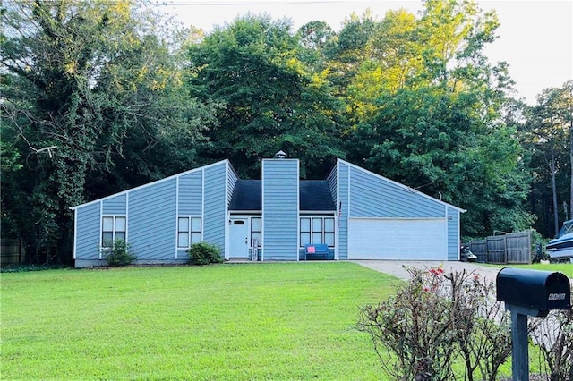 6821 Galts Ferry Rd, Acworth, GA 30102 - mid-century home featuring concrete driveway, a chimney, and an attached garage