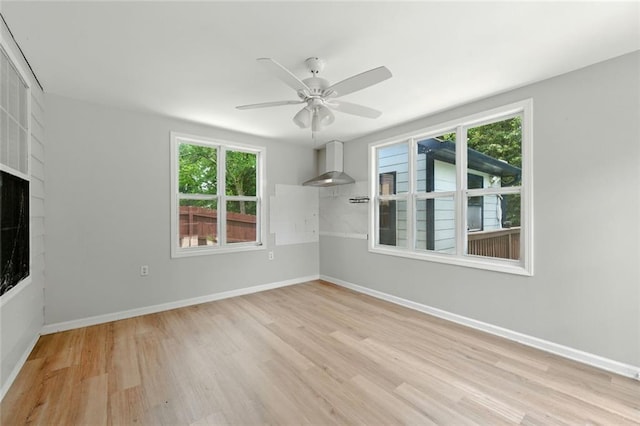 314 Spring Falls Dr, Lawrenceville, GA 30045 - unfurnished living room featuring wood finished floors, plenty of natural light, and ceiling fan
