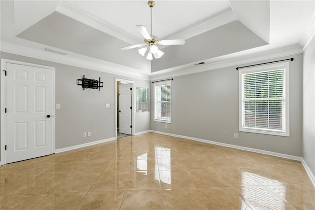 314 Spring Falls Dr, Lawrenceville, GA 30045 - empty room featuring a raised ceiling, crown molding, ceiling fan, and light tile patterned flooring