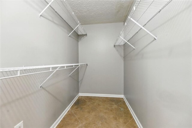 314 Spring Falls Dr, Lawrenceville, GA 30045 - spacious closet with tile patterned floors