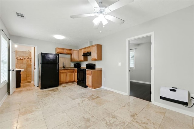 314 Spring Falls Dr, Lawrenceville, GA 30045 - kitchen with black appliances, plenty of natural light, light countertops, and ceiling fan