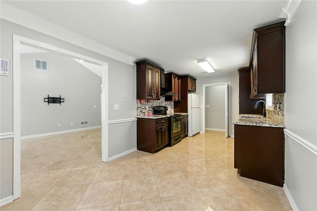 314 Spring Falls Dr, Lawrenceville, GA 30045 - kitchen featuring black electric range, freestanding refrigerator, decorative backsplash, and dark brown cabinetry