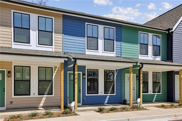 townhome / multi-family property featuring a porch