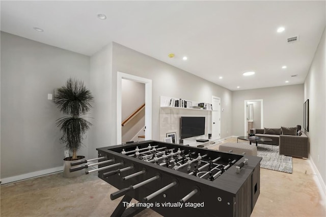 recreation room with light colored carpet, baseboards, and recessed lighting