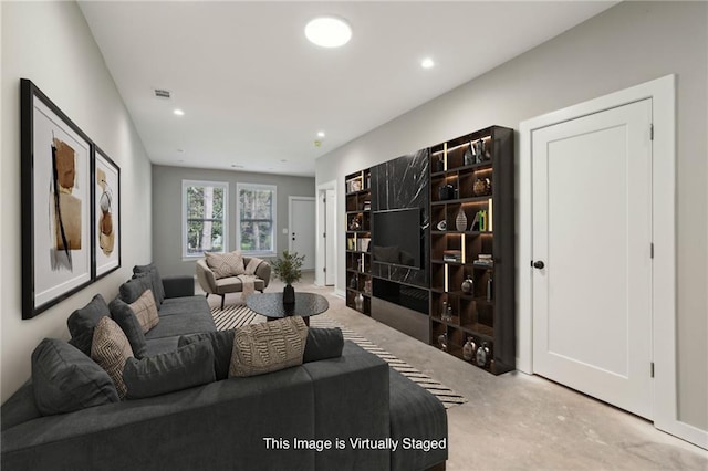 living area featuring carpet and recessed lighting