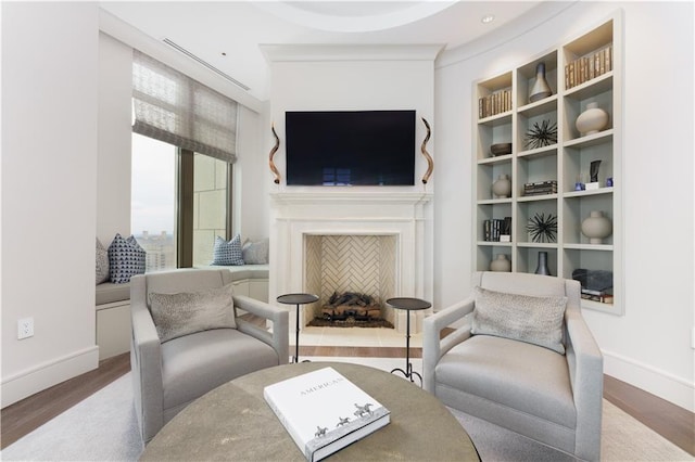 living area with hardwood / wood-style floors