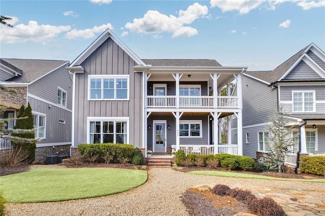 2304 Isla Run, Woodstock, GA 30188 - view of front of property with a balcony, board and batten siding, and a porch