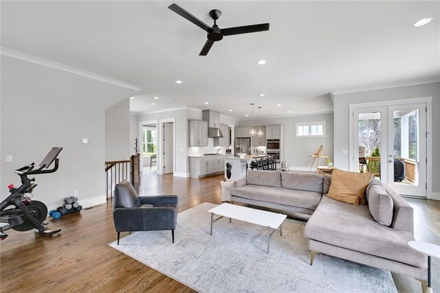 2304 Isla Run, Woodstock, GA 30188 - living room with ornamental molding, a ceiling fan, healthy amount of natural light, wood finished floors, and recessed lighting