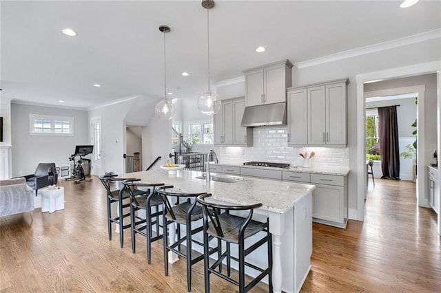 2304 Isla Run, Woodstock, GA 30188 - kitchen featuring a sink, under cabinet range hood, plenty of natural light, backsplash, and recessed lighting