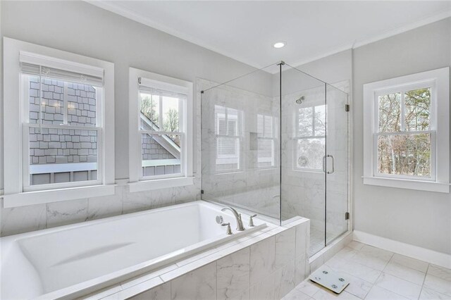 2304 Isla Run, Woodstock, GA 30188 - bathroom with a bath, plenty of natural light, a shower stall, baseboards, and ornamental molding