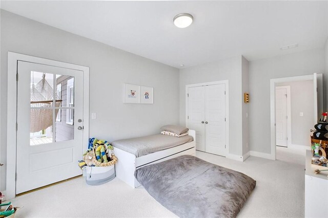 2304 Isla Run, Woodstock, GA 30188 - bedroom featuring light colored carpet, a closet, and baseboards