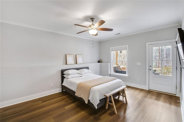 2304 Isla Run, Woodstock, GA 30188 - bedroom with baseboards, dark wood-style flooring, crown molding, and ceiling fan
