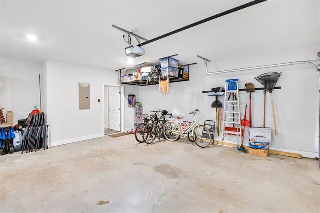 2304 Isla Run, Woodstock, GA 30188 - garage with electric panel and a garage door opener