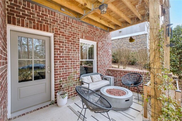 2304 Isla Run, Woodstock, GA 30188 - view of patio featuring a fire pit