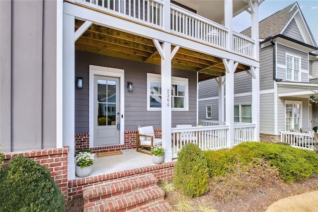 2304 Isla Run, Woodstock, GA 30188 - view of exterior entry with a porch