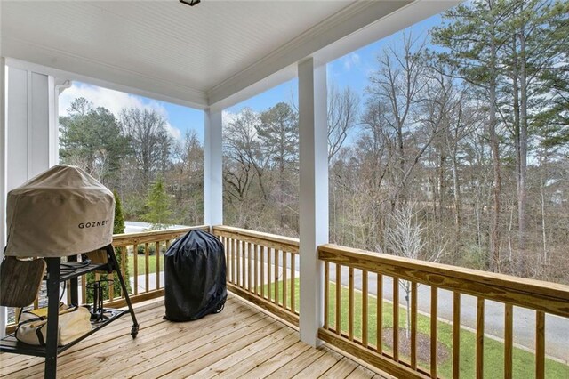 2304 Isla Run, Woodstock, GA 30188 - wooden terrace featuring view of scattered trees and grilling area
