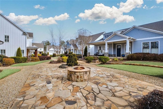 2304 Isla Run, Woodstock, GA 30188 - view of property's community with a fire pit, a residential view, and a patio
