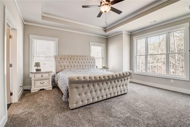 569 White Oak Way, Monroe, GA 30655 - carpeted bedroom with a tray ceiling, multiple windows, crown molding, and ceiling fan
