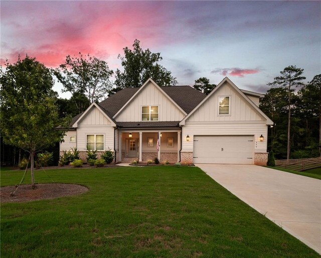 569 White Oak Way, Monroe, GA 30655 - view of front facade with a lawn and a porch
