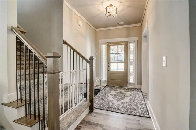 569 White Oak Way, Monroe, GA 30655 - foyer entrance featuring hardwood / wood-style flooring and crown molding