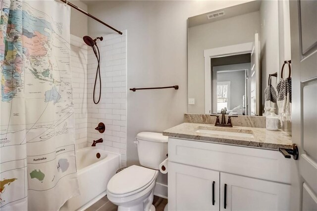 569 White Oak Way, Monroe, GA 30655 - full bathroom featuring shower / bathtub combination with curtain, vanity, and toilet