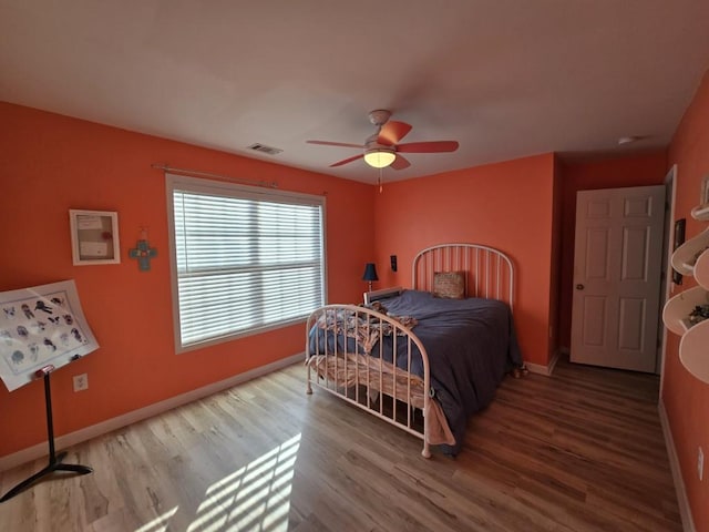 bedroom featuring ceiling fan and wood-type flooring