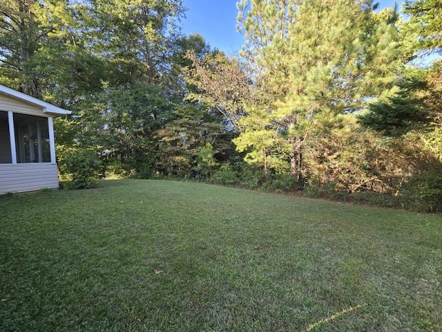 view of yard featuring a sunroom