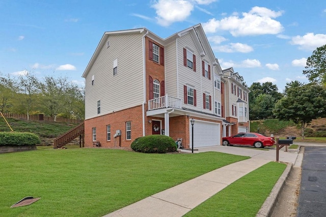 view of side of property with a yard and a garage